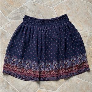 Navy blue skirt, floral design, size XS. New!